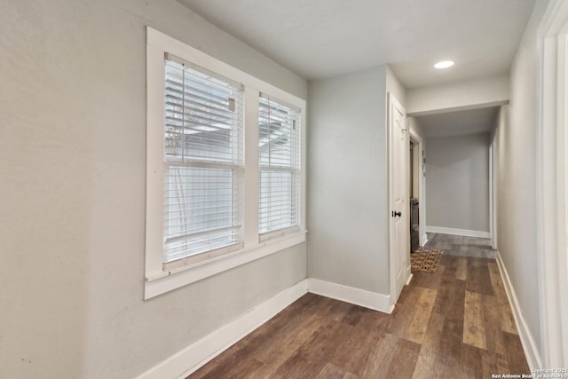 hall with dark hardwood / wood-style flooring