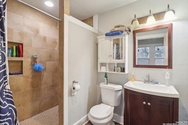 bathroom featuring a shower with curtain, vanity, and toilet