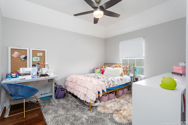 bedroom with ceiling fan and wood-type flooring