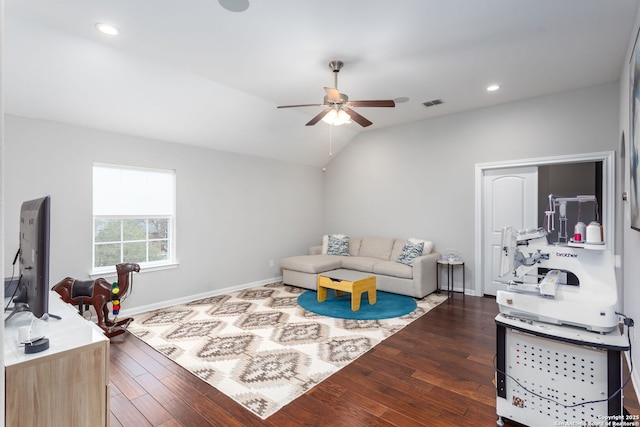 living room with vaulted ceiling, ceiling fan, and dark hardwood / wood-style flooring