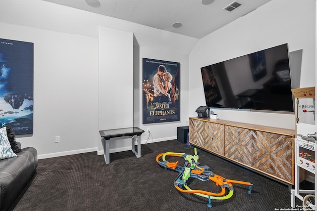 home theater with lofted ceiling and carpet flooring