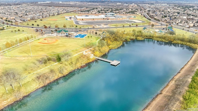 birds eye view of property with a water view