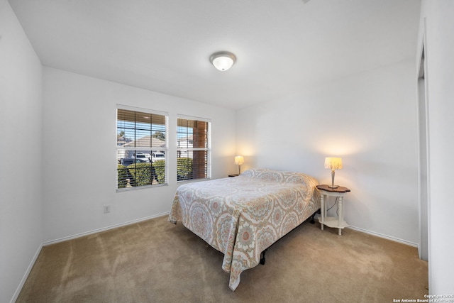 bedroom featuring light colored carpet