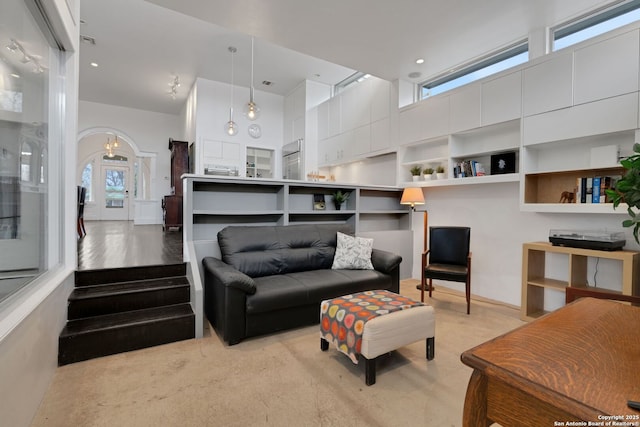 living room with a towering ceiling