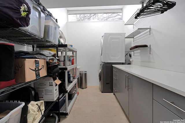 laundry room with stacked washer and dryer