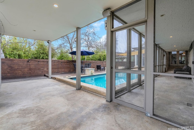 view of swimming pool with a patio area