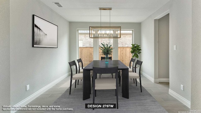 dining area featuring an inviting chandelier