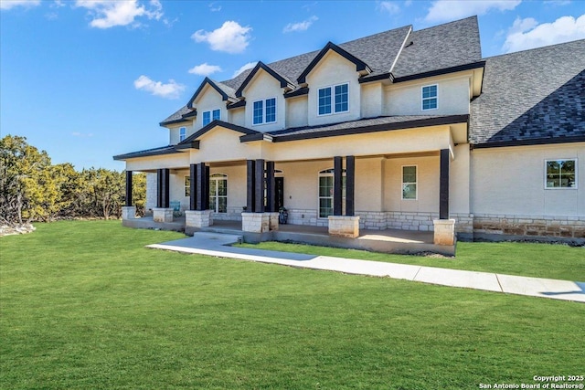 view of front of home with a porch and a front yard