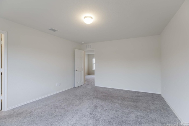 unfurnished room with light colored carpet