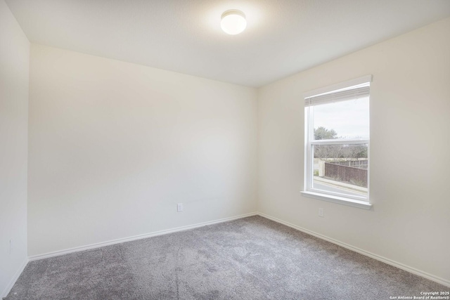 empty room featuring carpet flooring