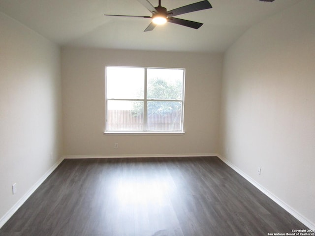 spare room with ceiling fan and dark hardwood / wood-style floors