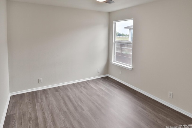 spare room featuring dark wood-type flooring