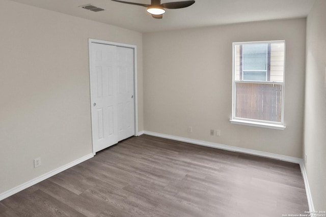 unfurnished room featuring wood-type flooring and ceiling fan