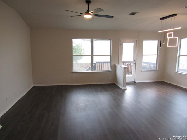 unfurnished room featuring ceiling fan and dark hardwood / wood-style floors