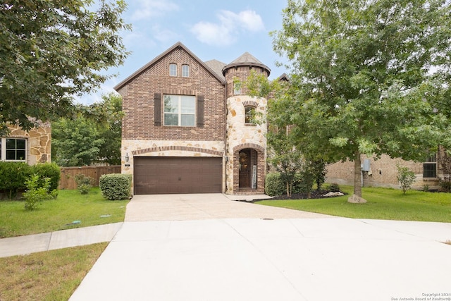 view of front facade featuring a garage and a front lawn