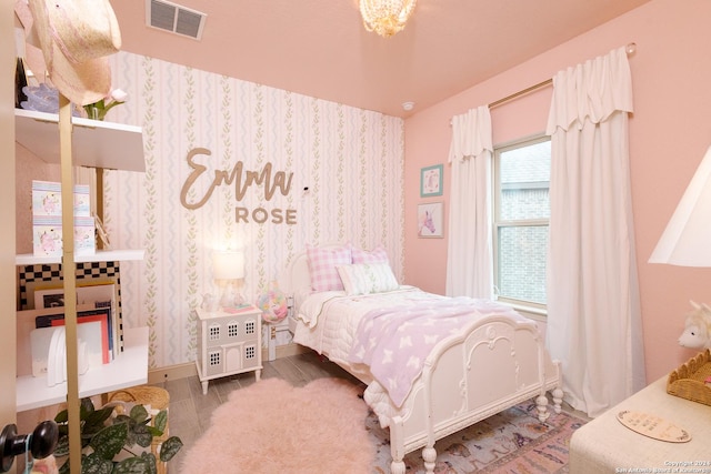 bedroom featuring a chandelier