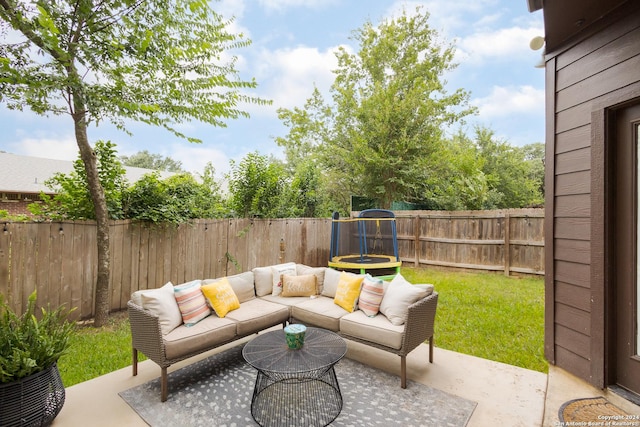 view of patio with a trampoline and an outdoor hangout area