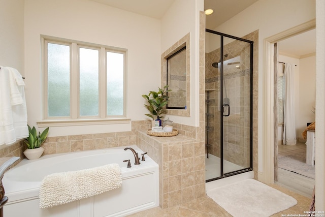 bathroom featuring plus walk in shower and tile patterned floors