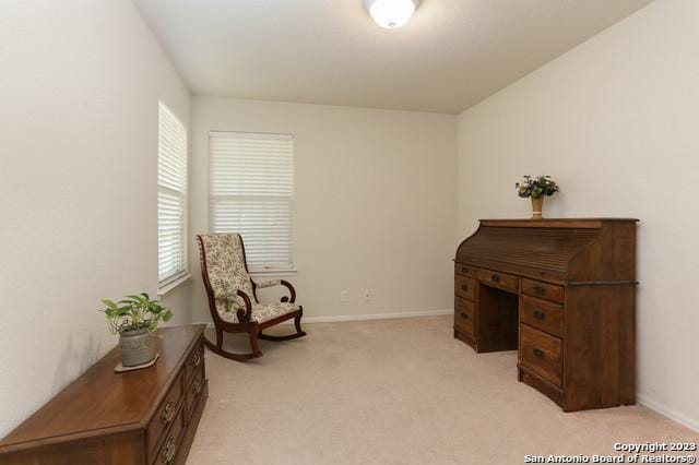 living area with light carpet