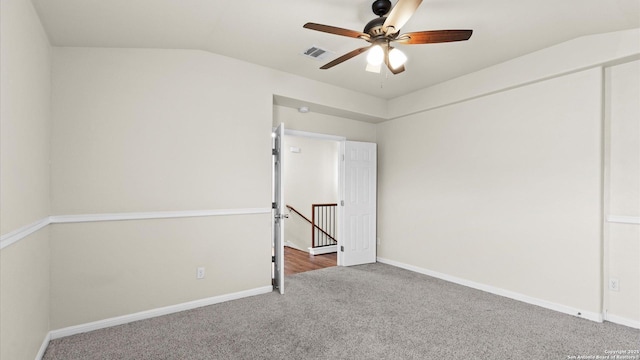 unfurnished room with vaulted ceiling, carpet, and ceiling fan