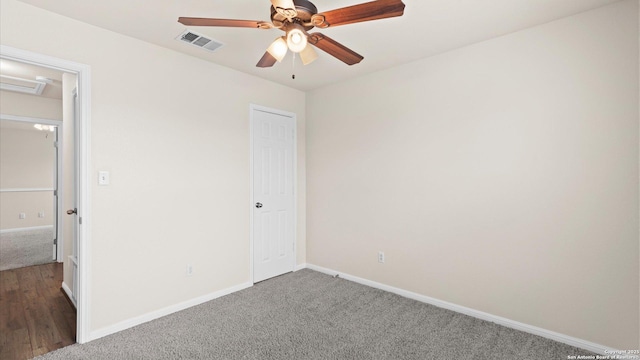 unfurnished bedroom featuring ceiling fan and carpet