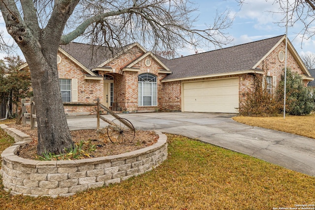 ranch-style home featuring a garage and a front lawn