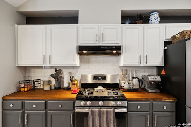 kitchen with white cabinetry, wooden counters, stainless steel gas range oven, and gray cabinetry