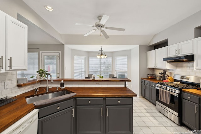 kitchen featuring white cabinetry, butcher block counters, stainless steel gas range, and sink