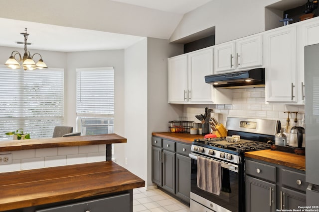 kitchen with white cabinetry, stainless steel gas stove, gray cabinetry, and wooden counters