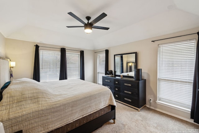 carpeted bedroom with ceiling fan and lofted ceiling