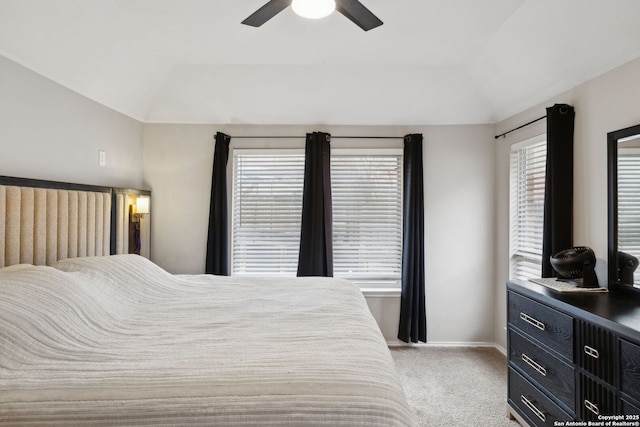 bedroom featuring lofted ceiling, light colored carpet, and ceiling fan