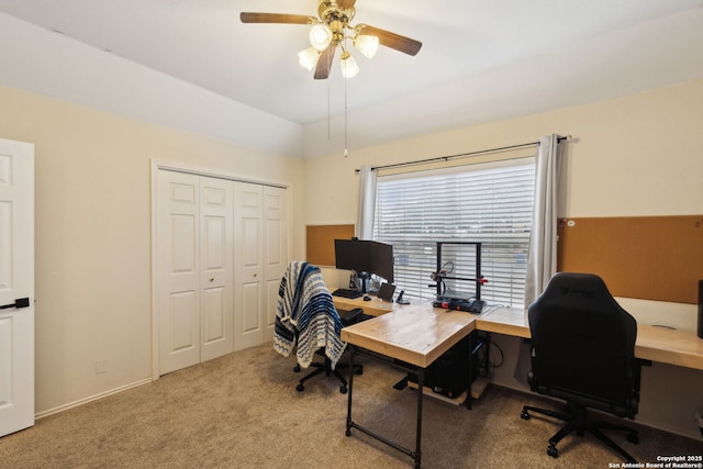 office featuring vaulted ceiling, light colored carpet, and ceiling fan