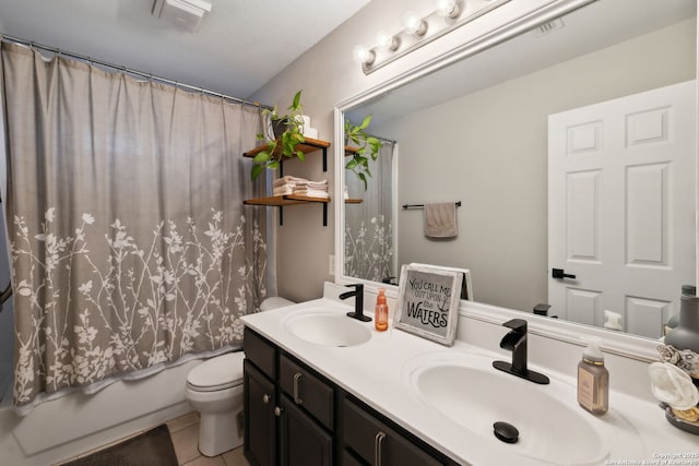 full bathroom featuring tile patterned floors, vanity, toilet, and shower / tub combo