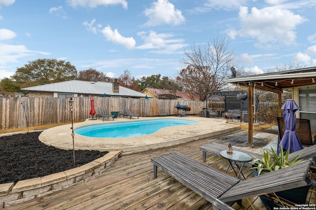 view of pool featuring a grill, a pergola, and a deck