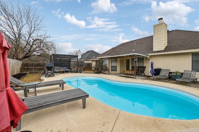 view of swimming pool with a patio area and a pergola