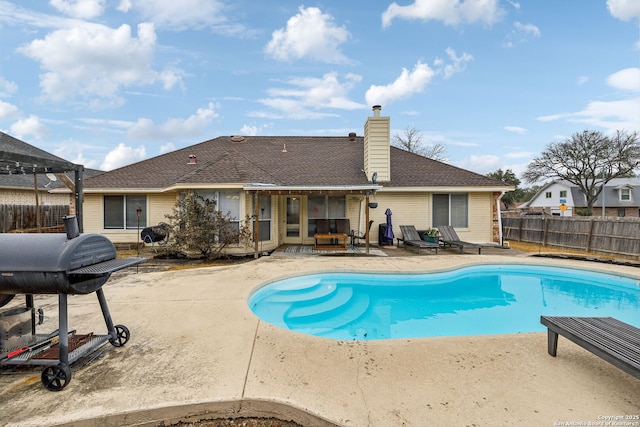 view of pool featuring a grill, a pergola, and a patio area