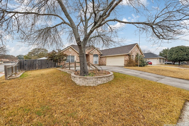 single story home featuring a garage and a front yard