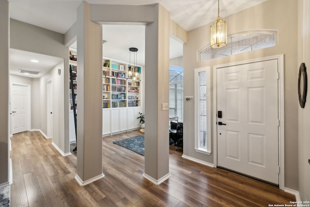 entrance foyer featuring dark hardwood / wood-style floors