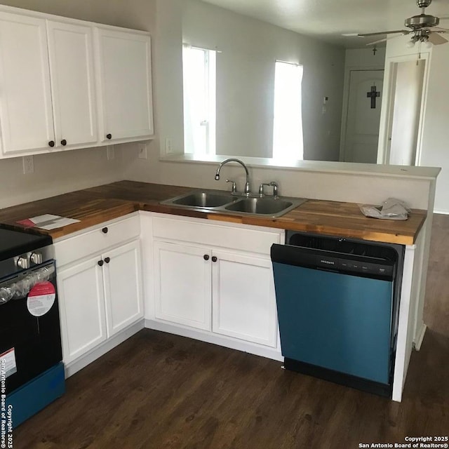 kitchen featuring white cabinetry, sink, wooden counters, dark hardwood / wood-style flooring, and stainless steel appliances