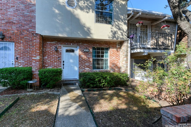 view of front of home with a balcony