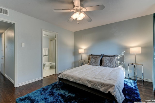 bedroom with ceiling fan, dark hardwood / wood-style floors, and ensuite bath