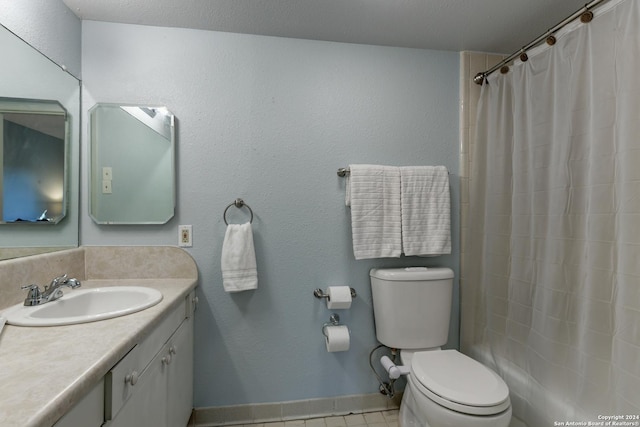 bathroom with tile patterned flooring, vanity, walk in shower, and toilet