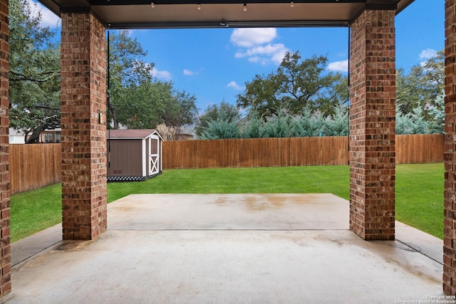 view of patio / terrace with a shed