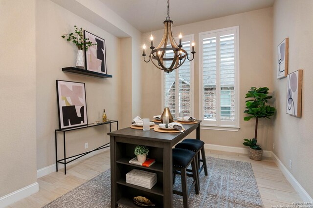 dining area with a chandelier and a healthy amount of sunlight