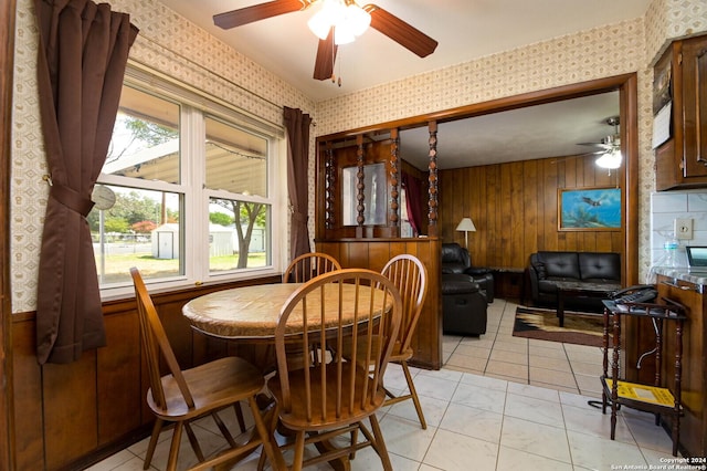 tiled dining room with ceiling fan