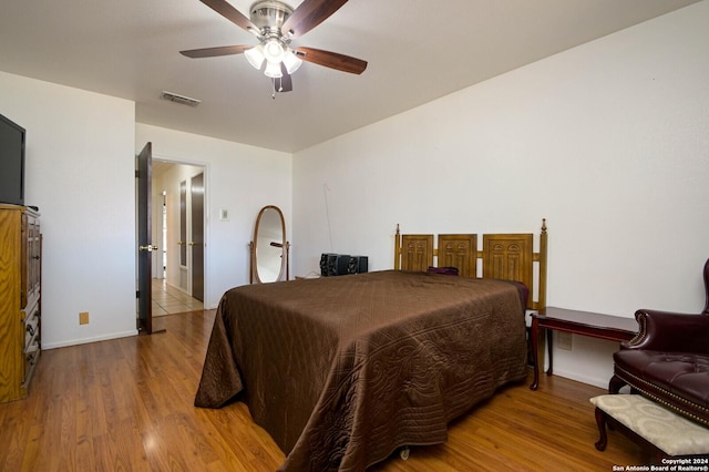 bedroom featuring wood-type flooring and ceiling fan