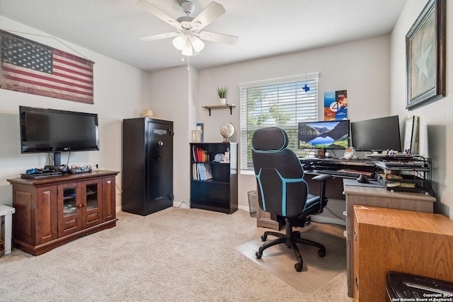 carpeted home office with ceiling fan