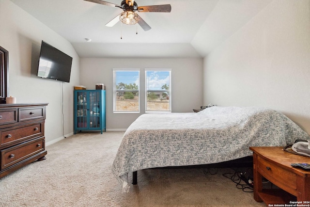 bedroom featuring ceiling fan, lofted ceiling, and light carpet