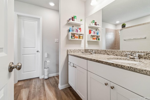 bathroom featuring vanity and hardwood / wood-style floors