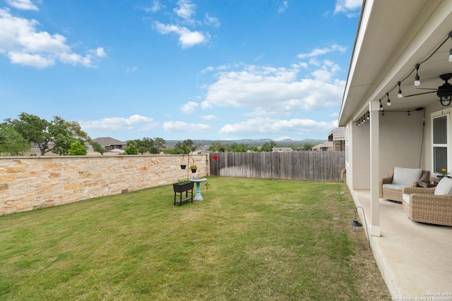 view of yard with ceiling fan